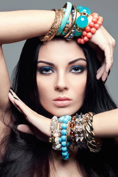 Beautiful woman in bracelets — Stock Photo, Image