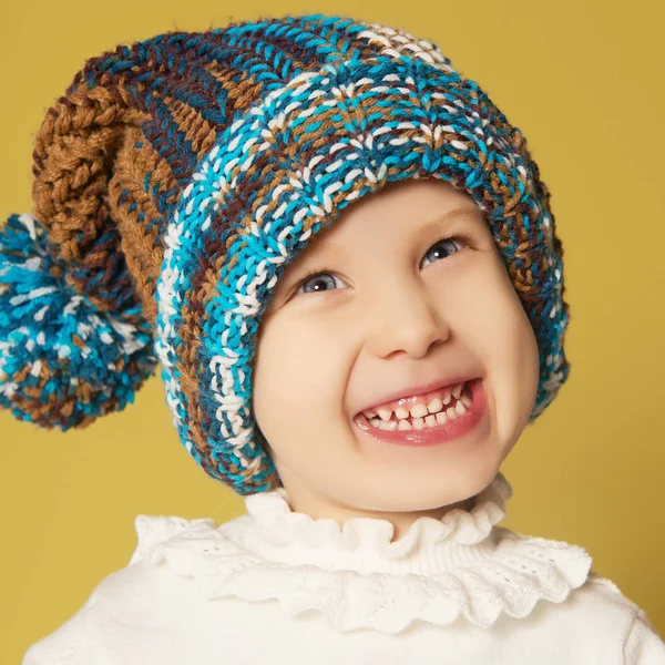 Smiling little girl in cap — Stock Photo, Image