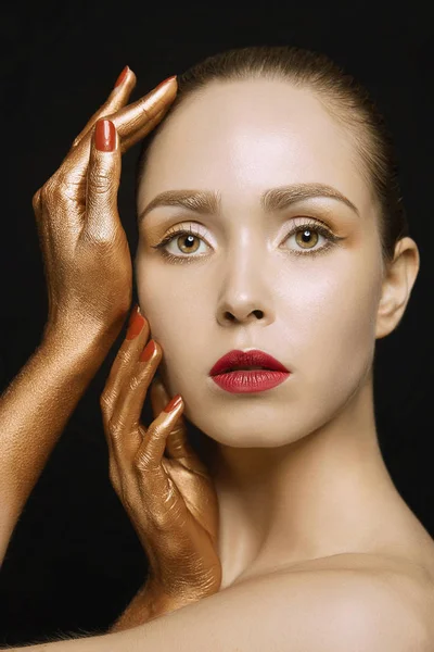 Fashion beauty young woman with golden hands — Stock Photo, Image