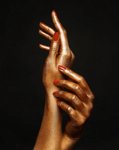 Female golden hands — Stock Photo, Image