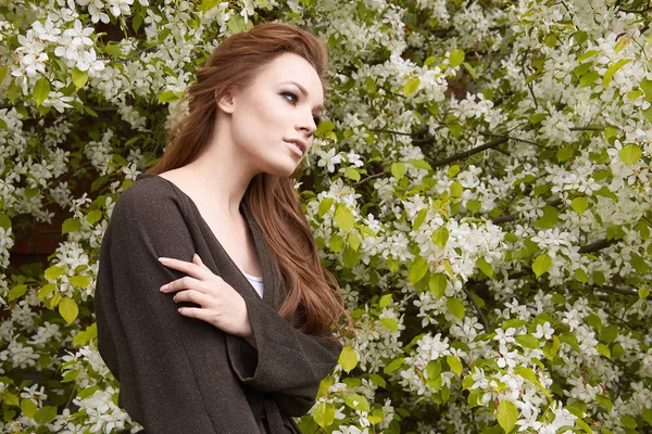 Beauty young woman in Apple-tree flowers — Stock Photo, Image