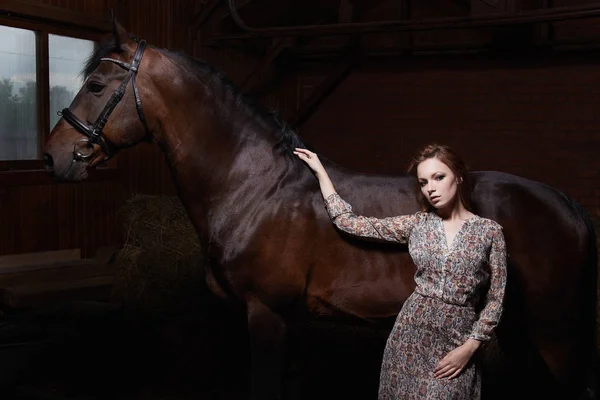 Beautiful young woman with a horse — Stock Photo, Image