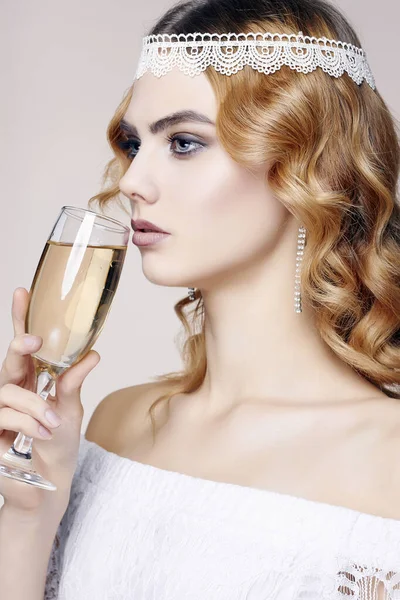 beautiful girl with glass of champagne at party. Elegant fashion glamour young lady