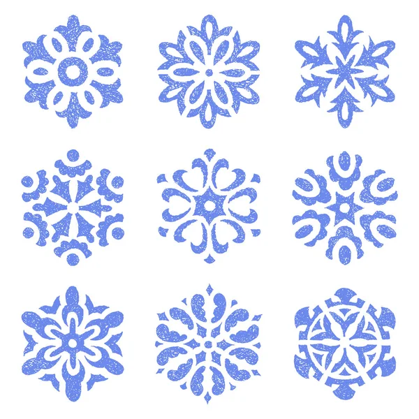Ensemble de flocons de neige vintage dessinés à la main sur papier. Bleu isolé — Image vectorielle