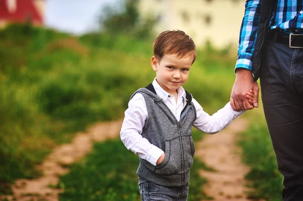 Father holding the hand of a small child — Stock Photo, Image