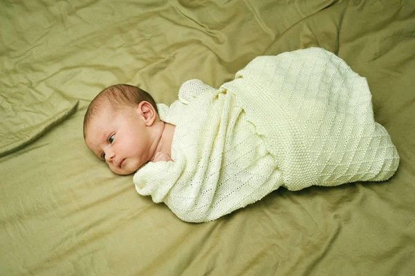 Portrait of the newborn girl wrapped in scarf — Stock Photo, Image