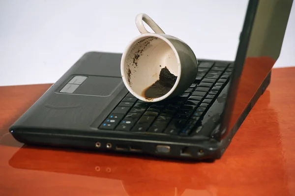 broken laptop filled coffee
