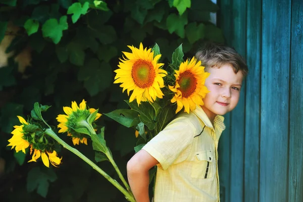 Handsome Boy Holding Sunflower Flowers — Stock Photo, Image