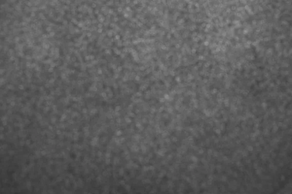 Grey blurry solid texture. Horizontal color photography.
