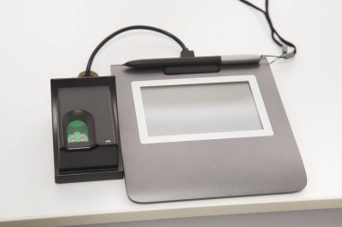 special modern equipment for scanning fingerprints clipart