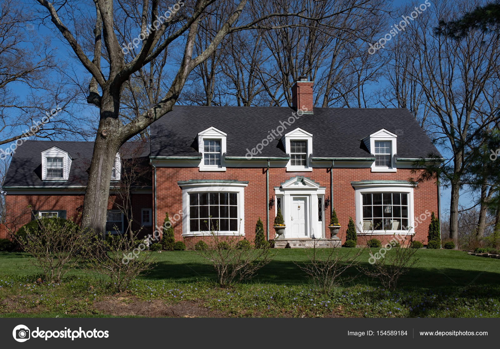 Brick Cape Cod House With Inset Dormers Stock Editorial Photo