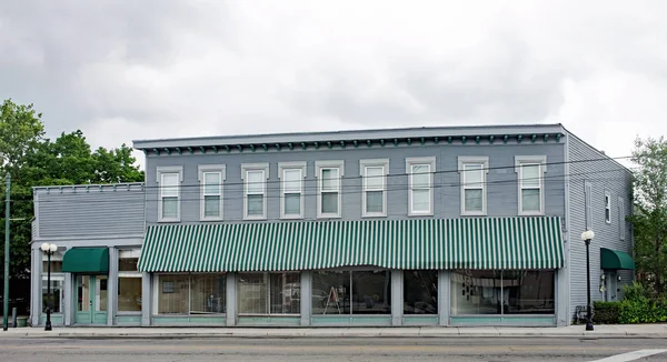 Old, Historic Business Building with Green Striped Awning — Stock Photo, Image