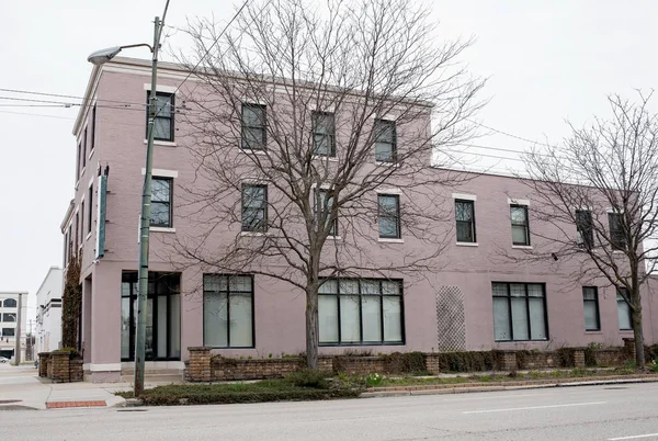 Old Lavender Painted Brick Building