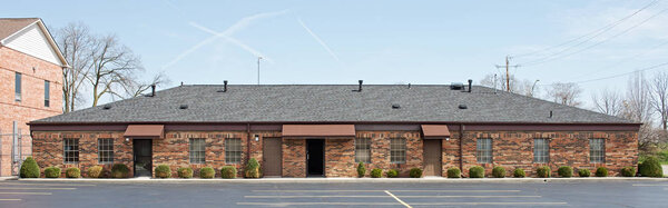 Long, Patchwork Brick Building