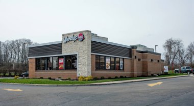 Dayton, Ohio - March 22, 2020: Wendy's Fast Food Restaurant chain offers drive-thru & take-out services only during recent pandemic COVID-19 outbreak. clipart