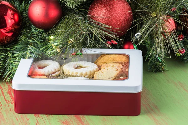 Assorted cookies in the box and christmas decoration. — Stock Photo, Image