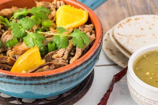 Mexican food. Slow cooked pork carnitas with salsa verde — Stock Photo, Image