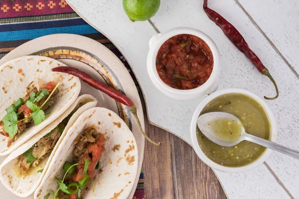 Mexican food. Slow cooked pork carnitas with salsa verde — Stock Photo, Image