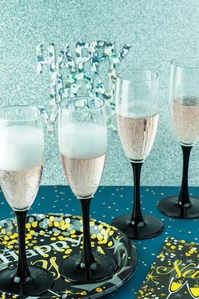 Glasses with sparkling wine for New Year party.
