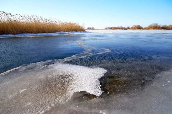 Winter ice landscape. Frozen river