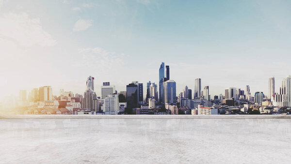 Panoramic Bangkok city in sunrise modern buildings, and concrete deck floor