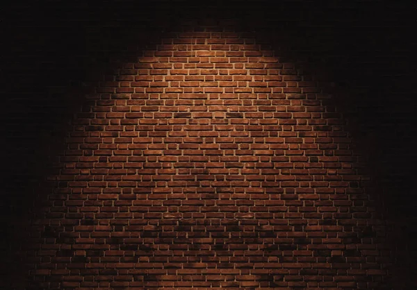 Cihlová zeď se světelným skvrnou na středovém pozadí — Stock fotografie