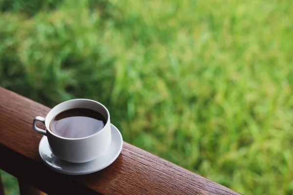 Coffee cup with saucer, on wood panel — Stock Photo, Image