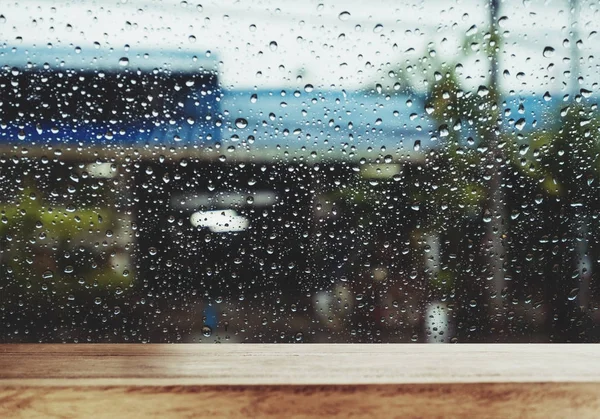 Wood Table with Raindrop on Window in Rainy Day, for background — Stock Photo, Image
