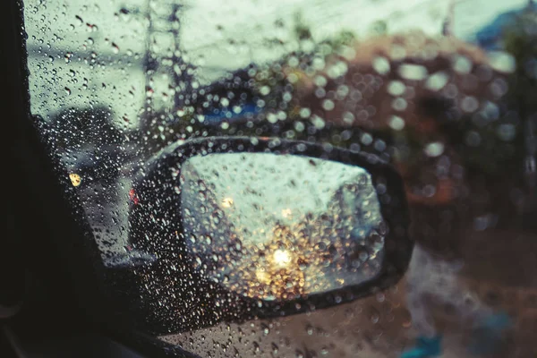 Rainy day on the road, Raindrops on car mirror with side wing mirror — Stock Photo, Image