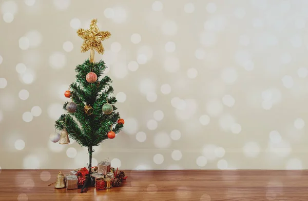 Christmas tree decoration with circle Bokeh lights on wooden floor, in living room