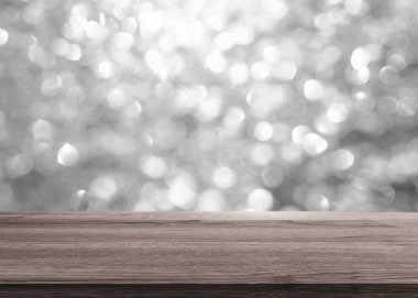 Ahşap masa üstü arka plan için bokeh ışık gümüş