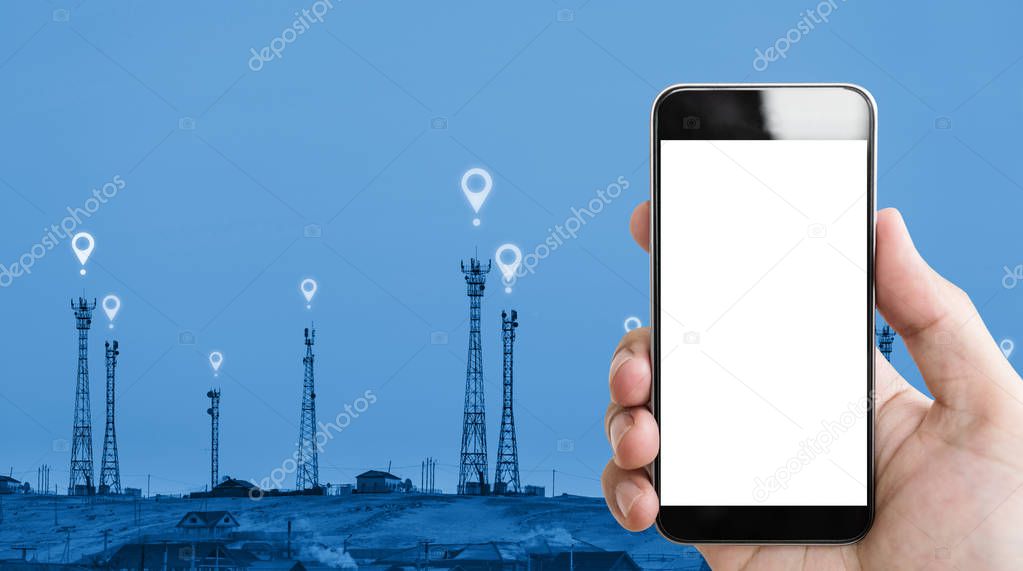Hand holding mobile phone white screen, telecommunication towers and location icons sign background