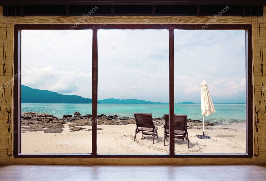 Opened window seeing tropical beach view in summer holiday at weekend house and resort. Summer holiday vacation