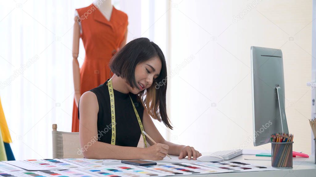 Young designer sketching and designing the new collection
