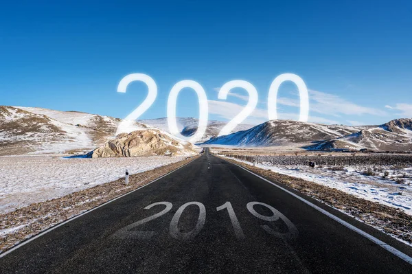 2020 at the way forward, and 2019 on the road in winter. New Year concepts