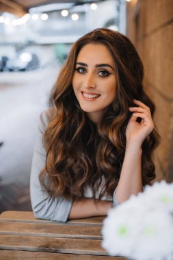 Young girl with professional makeup and hairstyle