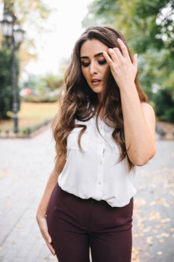 Young girl with professional makeup and hairstyle