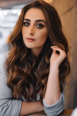 Young girl with professional makeup and hairstyle