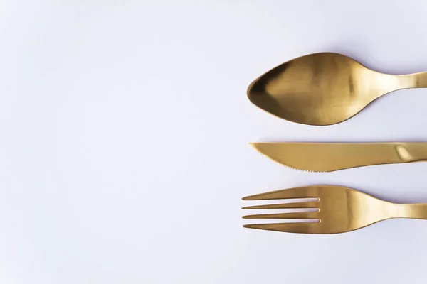 Gold cutlery set — Stock Photo, Image