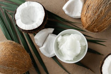 image of coconut oil and fresh coconuts . 