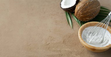 image of coconut cream or butter and coconuts at background 