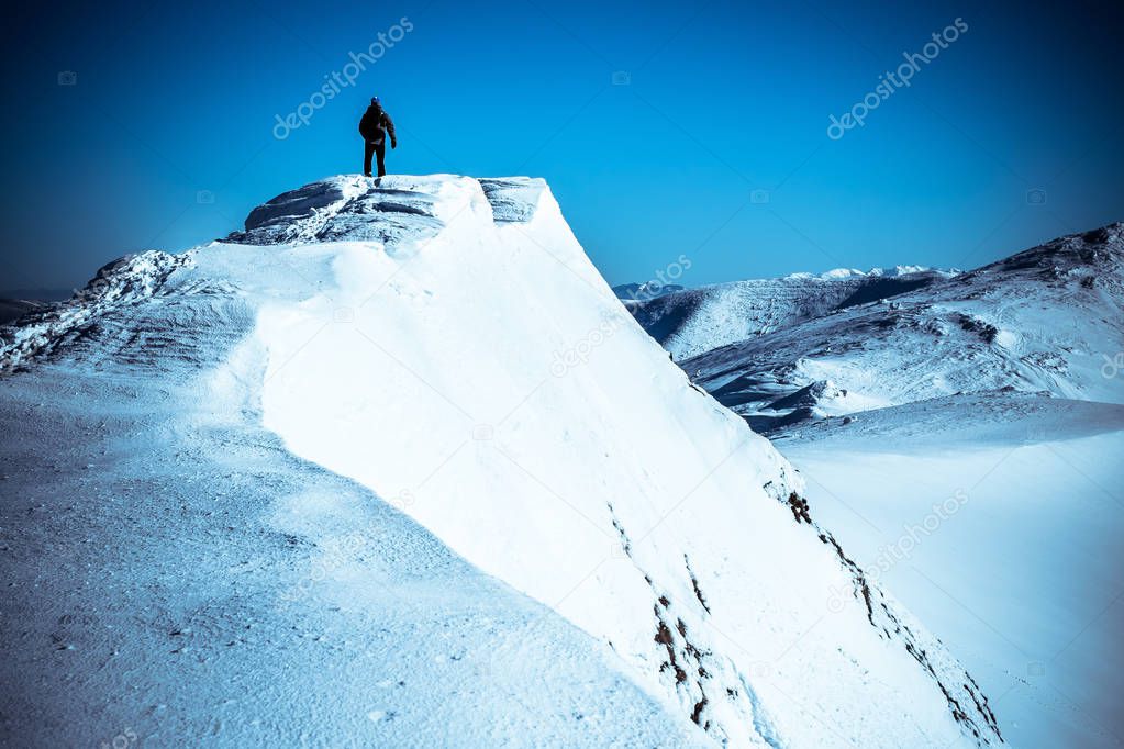 Sportsman on top mountain