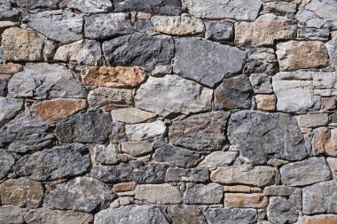 İyi yapılmış taş duvar, sorunsuz granit istinat duvarı, kaba taş arka plan, yüksek kaliteli modern taş duvar kaplama