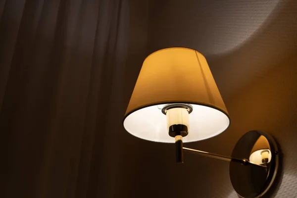 The lamp on the wall in the hotel