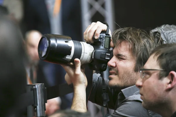 Fotograaf woont persconferentie — Stockfoto