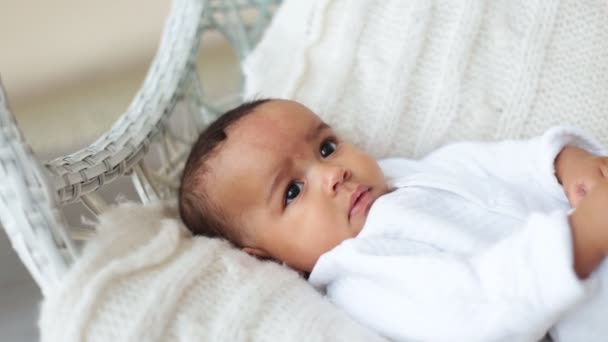 Baby lying on white sheet — Stock Video