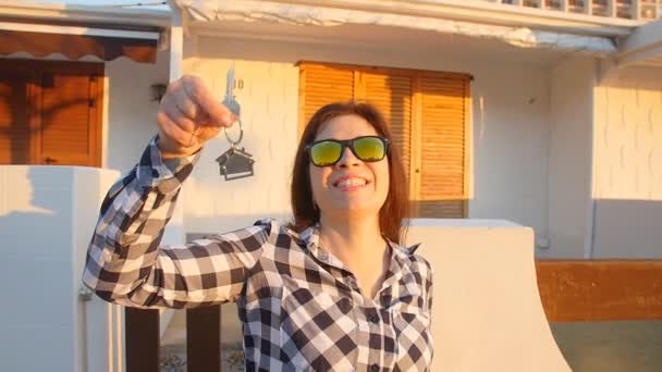 Happy young woman with New House Keys outdoors — Stock Video