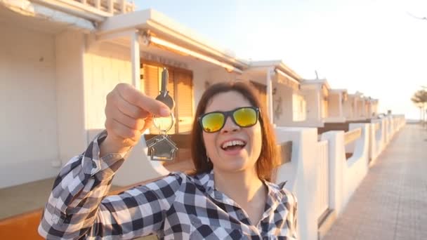 Happy young woman with New House Keys outdoors — Stock Video