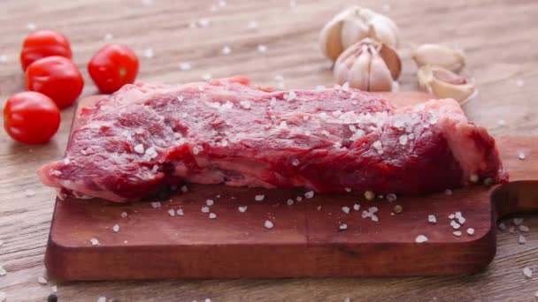 Raw fresh meat Steak with herbs and spices on rustic background — Stock Video