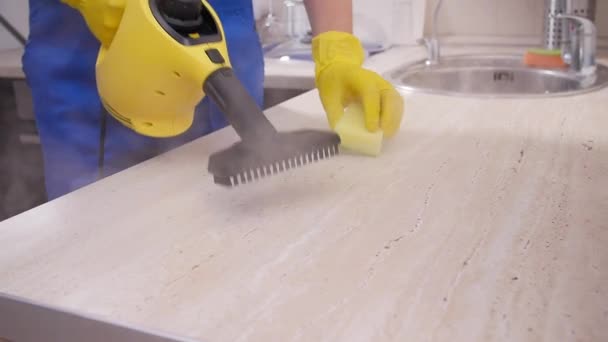 House cleaning concept. Man cleaning kitchen with steam cleaner — 비디오